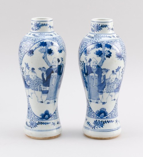 PAIR OF CHINESE BLUE AND WHITE PORCELAIN VASES In meiping form, with figural cartouches on a floral ground. Double ring marks on bas...