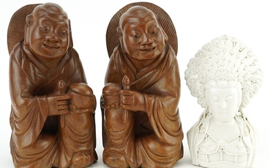 Pair of Chinese hardwood carvings of Buddha and blanc de chi...