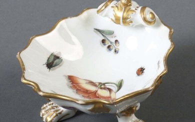 Rococo-Salière Meissen, 1722-1762, porcelain, glazed and decorated with polychrome paint on glaze, among other things lilies of the valley and insects, decorated with gold, shell-shaped bowl with a multi-passage rim, the back end curled like a volute...