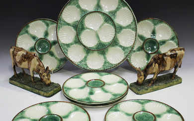Seven Longchamp majolica oyster dishes, comprising six plates and a platter, printed mark to bases