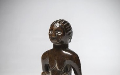TABWA, Tanzania. Female bust made of heavy wood...