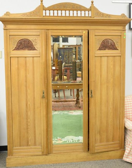 Three door pine armoire, having fitted drawers. ht. 91