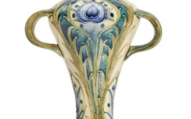 William Moorcroft (1872-1945), a Peacock pattern twin-handled...