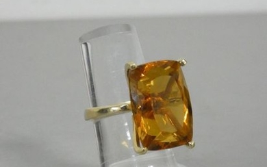 Yellow gold ring centered on a large citrine...