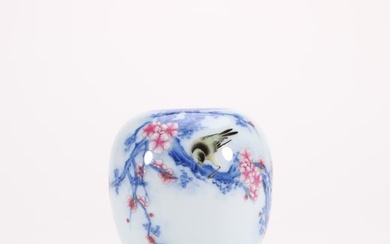 a blue and white and famille rose porcelain jar with floral and bird patterns from the Yongzheng