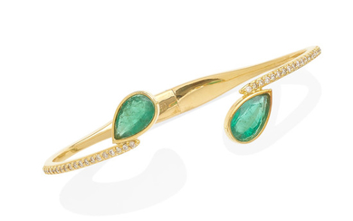 an emerald and diamond bangle