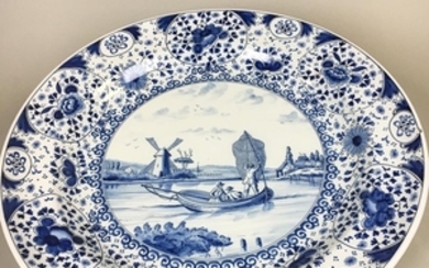 Large Delft Blue and White Ceramic Charger Depicting a Fishing Scene