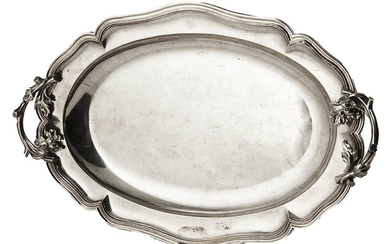12- Oval silver dish with curved edges decorated...