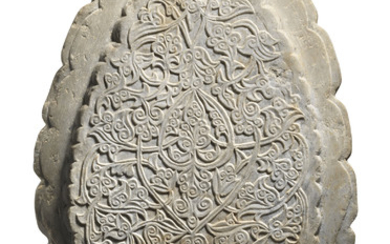 A DOUBLE-SIDED CARVED MARBLE SCALLOPED MEDALLION, 20TH CENTURY