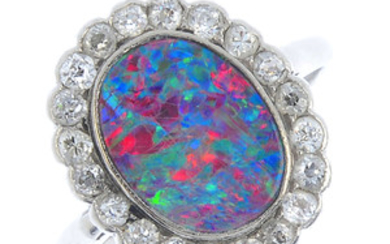 An early 20th century platinum, opal doublet and diamond cluster ring. View more details