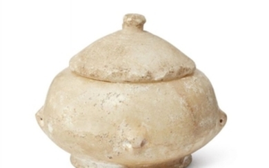 An Egyptian marble bowl with lug handles,...