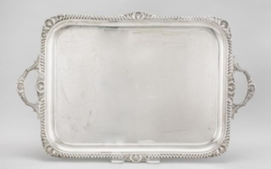 GEORGE V STERLING SILVER TRAY Atkin Brothers, maker. Georgian-style. Rectangular, with gadrooned rim and handles interrupted by shel...