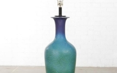 A large blue/green glazed vase mounted as a lamp
