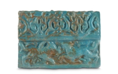 A MOULDED TURQUOISE-GLAZED POTTERY TILE Kashan, Iran, 13th...