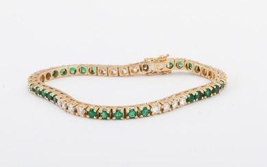18kt gold diamond and emerald tennis bracelet