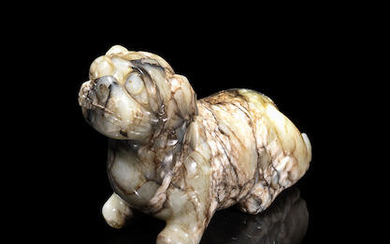 A mottled grey jade carving of a Buddhist lion
