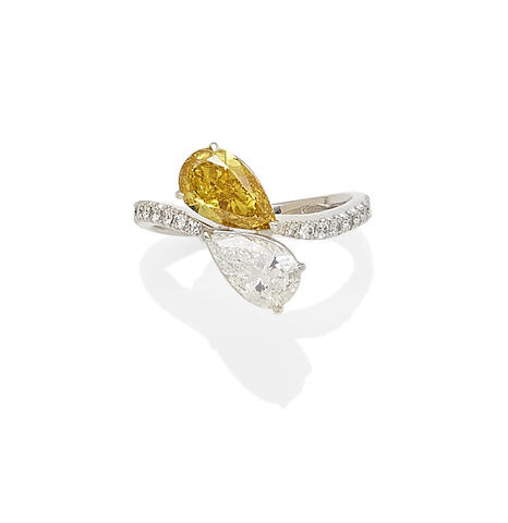 A Fancy Deep Yellow diamond and diamond ring