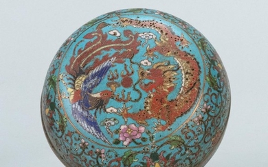CHINESE CLOISONNÉ ENAMEL BOX In ovoid form, with phoenix and dragon design on a blue passionflower ground. Four-character Qilong mar...