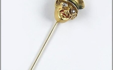A 14 Karat Yellow Gold Stick Pin.