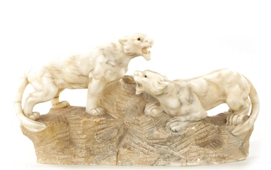 A 19TH CENTURY CARVED ALABASTER SCULPTURE OF TWO LIONS mount...