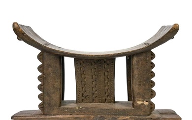 A 19th century Ashanti stool. Of typical form, height 33cm w...