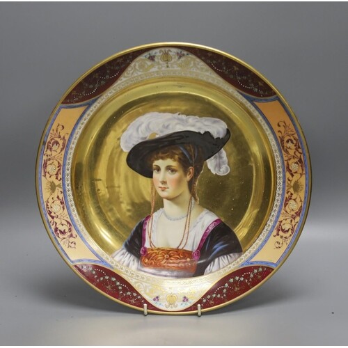 A 19th century Dresden porcelain charger, painted with a po...