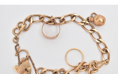 A 9CT GOLD CHARM BRACELET, a curb link bracelet fitted with ...
