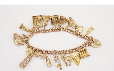 A 9ct gold curb link charm bracelet, hung with various gold ...