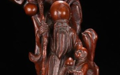 A BAMBOO CARVED FIGURE