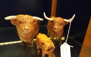A Beswick Highland Bull, cow and calf