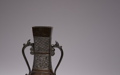 A CHINESE BRONZE TWO-HANDLED VASE