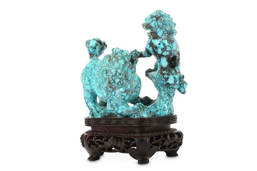 A CHINESE TURQUOISE ‘LION DOGS’ CARVING.