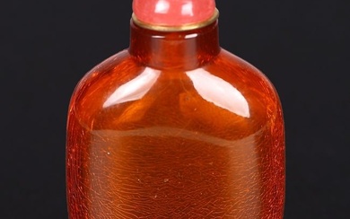 A CHINESE WELL-HOLLOWED AMBER SNUFF BOTTLE