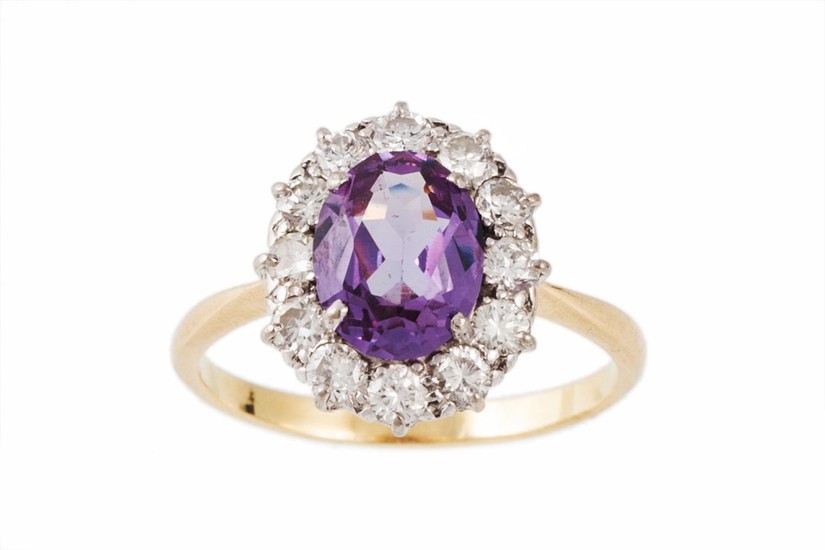 A COLOUR CHANGE SAPPHIRE AND DIAMOND CLUSTER RING, the centr...