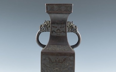 A Chinese bronze 'taotie' dragon-handled vase, 17th/18th century