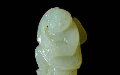A Chinese carved jade 'boy' pendant, 18th/19th century