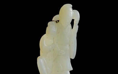 A Chinese carved jade 'figure' pendant, 19th century