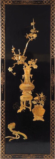 A Chinese lacquered wood panel, early 20th century, decorated with inlaid shells carved as flowering prunus branches issuing from a vase and a ruyi sceptre, 92 x 30cm
