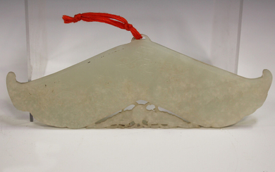 A Chinese pale celadon jade chime pendant (huang), late Qing dynasty/early 20th century, each side c