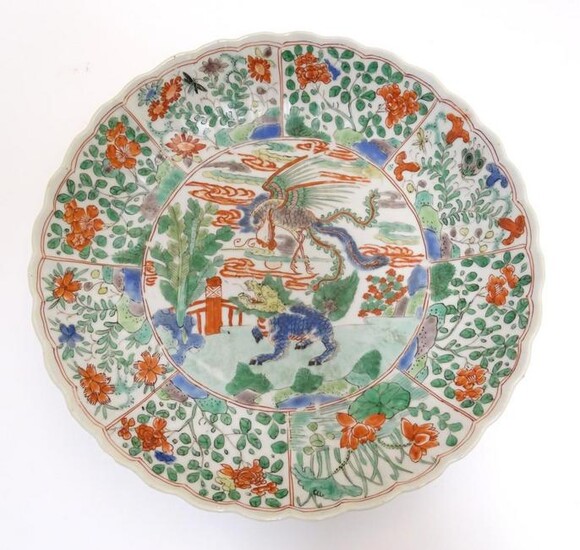 A Chinese plate with a lobed rim and hand painted