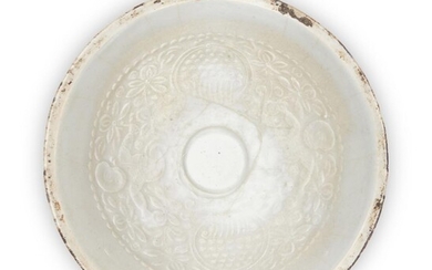 A Chinese qingbai 'boys' bowl, Song dynasty, of conical shape raised on a short foot, decorated to the inside of the bowl with moulded design of boys among floral ground below a dotted border, rim unglazed, 17.5cm diameter. 宋 青白模印‘童子’圖紋斗笠碗