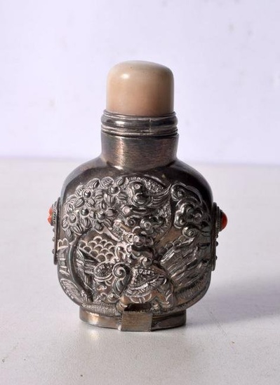 A Chinese white metal embossed snuff bottle 8 cm.