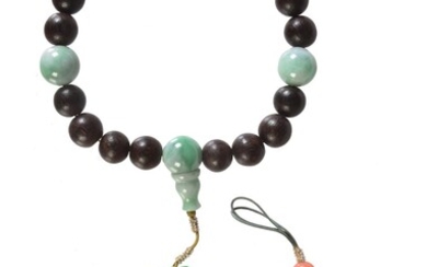 A Chinese wood and jadeite rosary bracelet