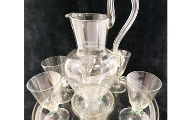 A Continental clear glass water set, comprised of a jug with...