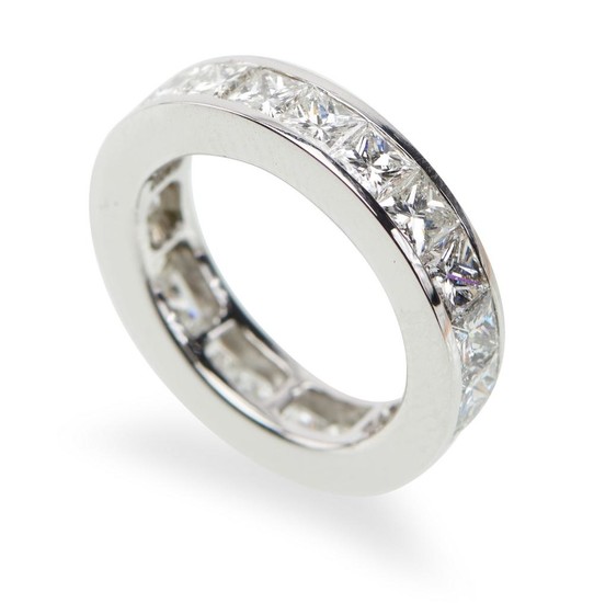 A DIAMOND ETERNITY RING-The full circle ring set with twenty one princess cut diamonds totalling 6.50cts, in 18ct white gold, ring s...
