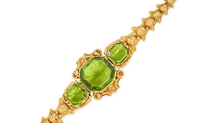 A FINE ANTIQUE PERIDOT BRACELET in yellow gold, set with three octagonal step cut peridots, the p...