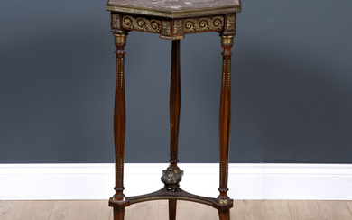 A French marble topped and ormolu mounted hexagonal walnut torchiere...