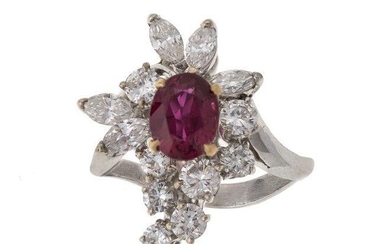 A French, ruby and diamond cluster ring, the central oval mixed-cut ruby with brilliant and marquise-cut diamond asymmetric design surround to a plain hoop with crossover shoulders, French assay and indistinct maker's mark to hoop, ring size K