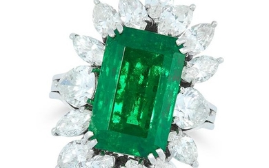 A GARNET AND DIAMOND DRESS RING set with an emerald cut