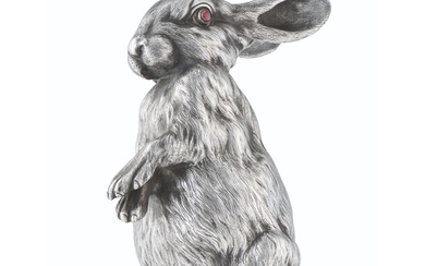 A GEM-SET SILVER BELL-PUSH IN THE FORM OF A RABBIT